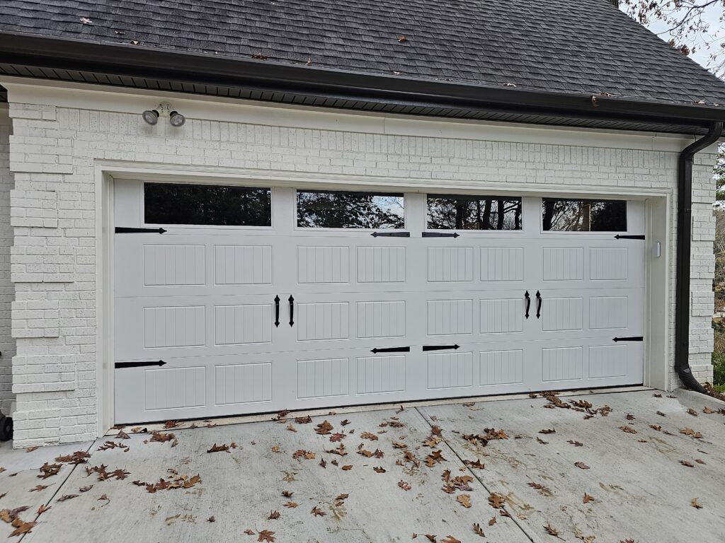 18X7 Doorlink model 431 Stamped Carriage door with plain windows. Balance your garage Doors annually.